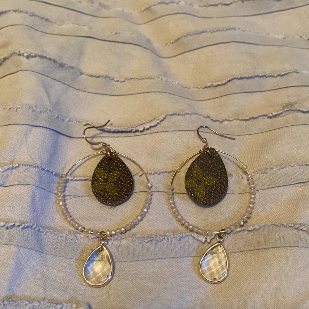 Gold hoop and beaded earring with repurposed L*V*. Very beautiful and light.